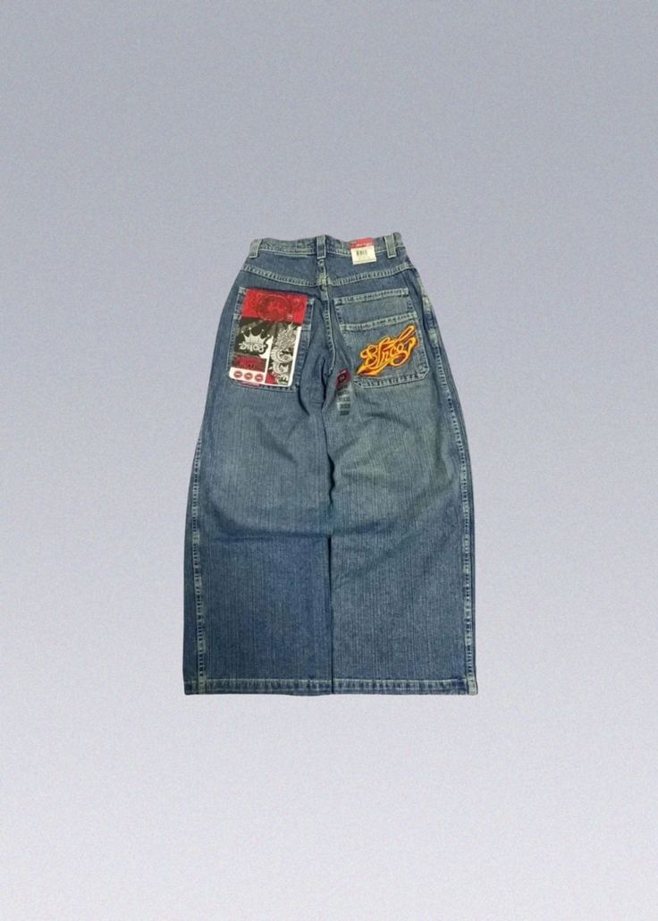 Vintage JNCO Jeans Y2K These Jnco Y2K Jeans feature a classic design that captures the essence of the 2000s fashion scene. With their wide leg, relaxed fit, and distinctive stitching, these jeans are a statement piece that will set you apart from the crowd. The attention to detail in the design ensures an authentic and unique look. - Details: 100% Cotton Super high quality and details Delivery within 2 weeks ☞ View MoreBranded Streetwear 90s High-waisted Jeans For Streetwear, 90s Baggy Flare Cotton Jeans, 90s Style Baggy Cotton Flare Jeans, Y2k High Rise Flare Jeans For Streetwear, 90s Full Length Flare Jeans With Pockets, 90s Style Flare Jeans For Streetwear, 90s Inspired Wide Leg Bottoms With Pockets, 90s Style Dark Wash Bottoms For Streetwear, 90s Wide Leg Cargo Jeans