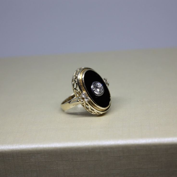 Classic Black Enamel Round Ring, Black Oval Cluster Ring For Anniversary, Formal Oval Black Enamel Ring, Black Enamel Diamond Anniversary Ring, Formal Oval 14k Gold Enamel Ring, Gold Diamond Ring With Black Enamel, Formal Black Enamel Oval Ring, Formal Oval Enamel Ring With Black Enamel, Formal Gold Diamond Ring With Black Enamel