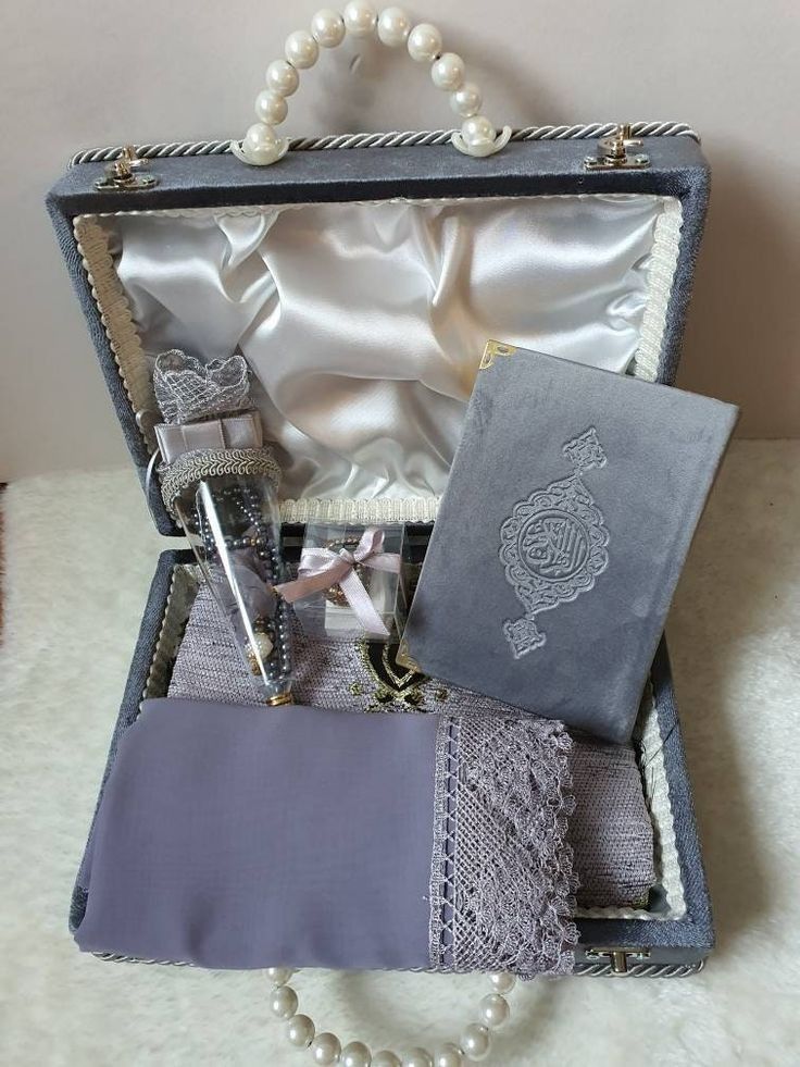 an open suitcase with pearls and other items in it