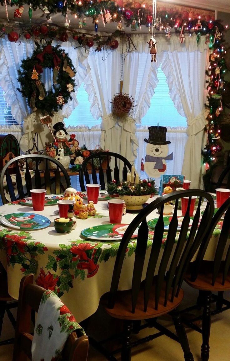 a dining room table covered in christmas decorations