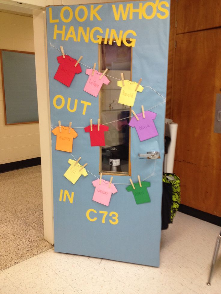 a bulletin board with clothes hanging on it and the words look who's hanging out in ct3