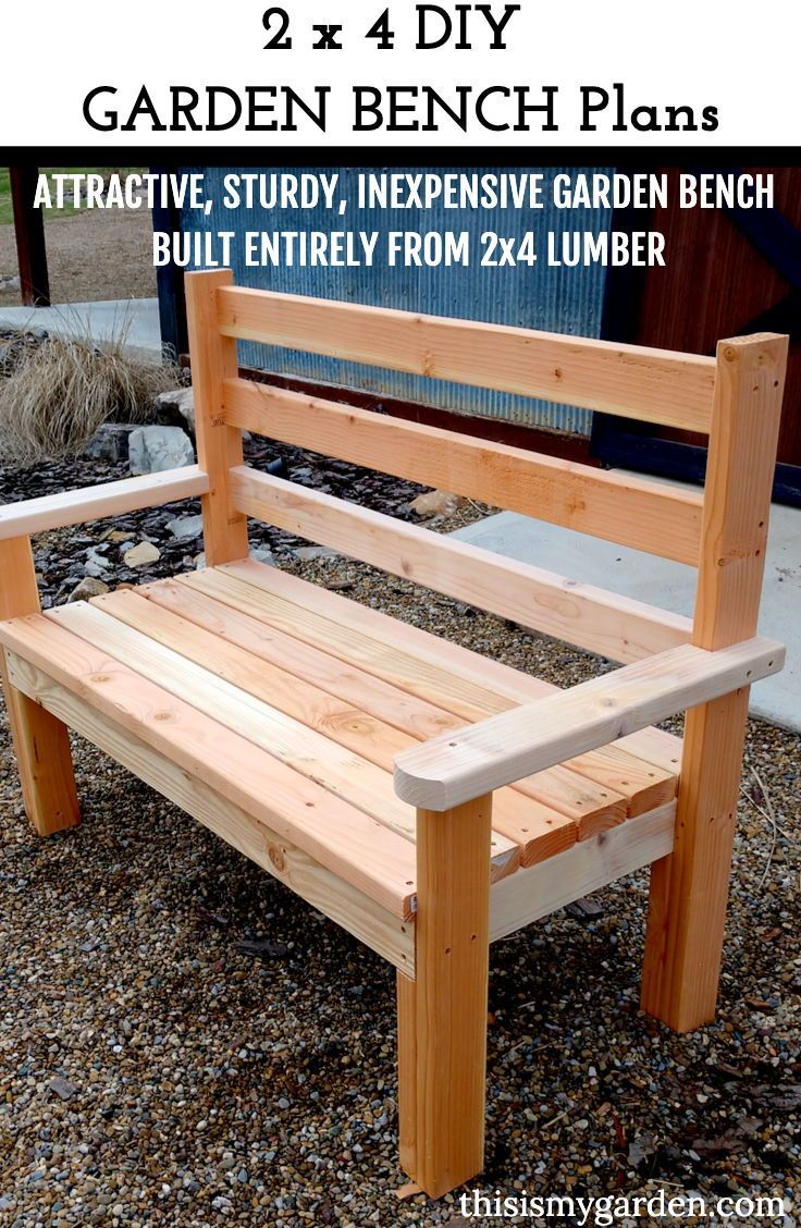 a wooden bench sitting on top of gravel