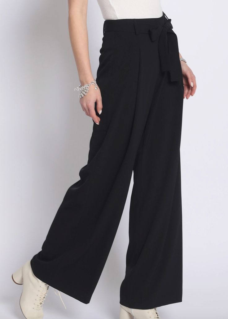 Super chic black wide leg pants with tie waist detail. Excellent quality material. Runs true to size. Model is wearing size small. Solid Wide Leg High Waist Pants With Tie Waist, Solid Wide Leg Pants With Tie Waist, High Waist Wide Leg Pants With Tie Waist, Chic Belted Full Length Pants, Versatile Belted Wide Leg Pants, Versatile Black Wide Leg Pants For Night Out, Elegant Wide Leg Pants With Tie Waist For Spring, Elegant Spring Wide Leg Pants With Tie Waist, Chic Evening Dress Pants With Belt Loops