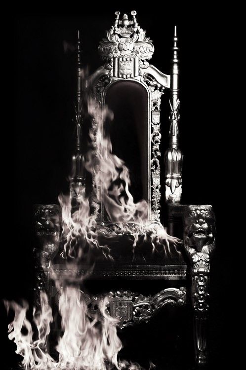 the poster for queen of shadows, which features flames coming out of an old chair