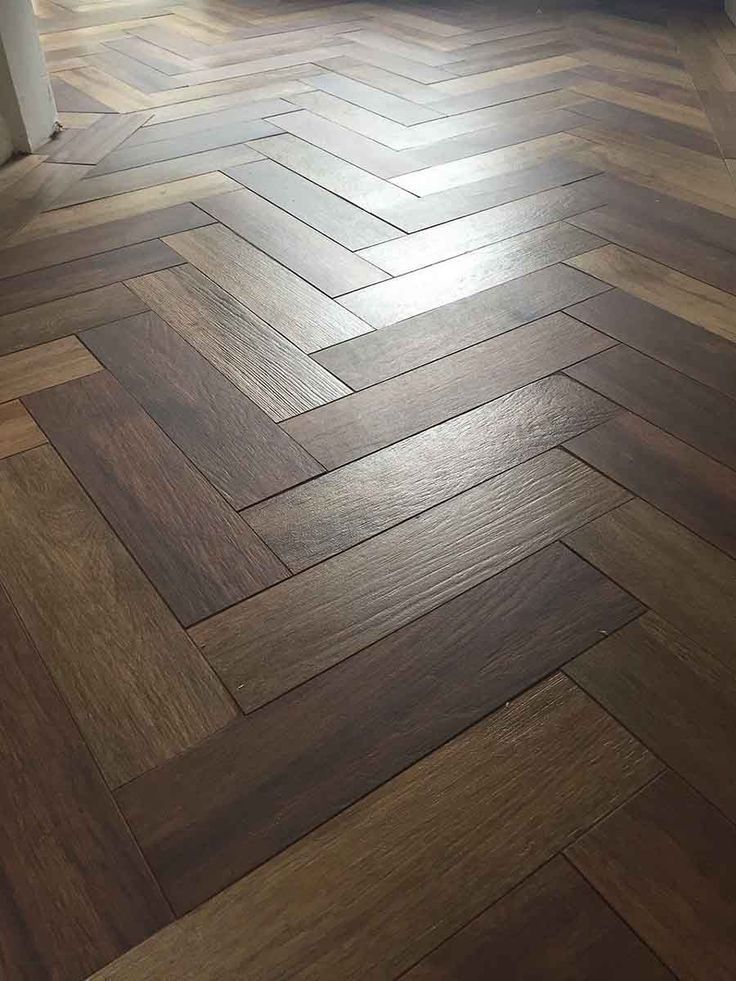 a wood floor that has been cleaned and is in the process of being installed to an apartment