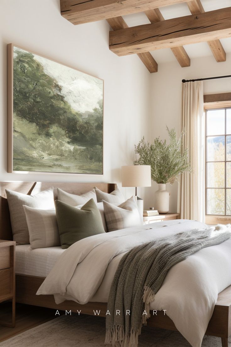 a bedroom with a large painting on the wall above the bed, and an area rug in front of the bed