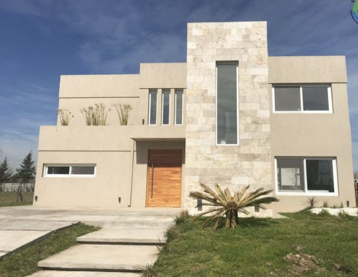 a modern house is shown in the daytime