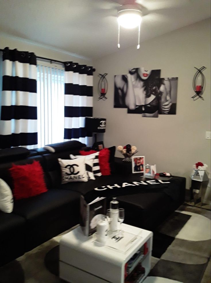 a living room with black and white decor