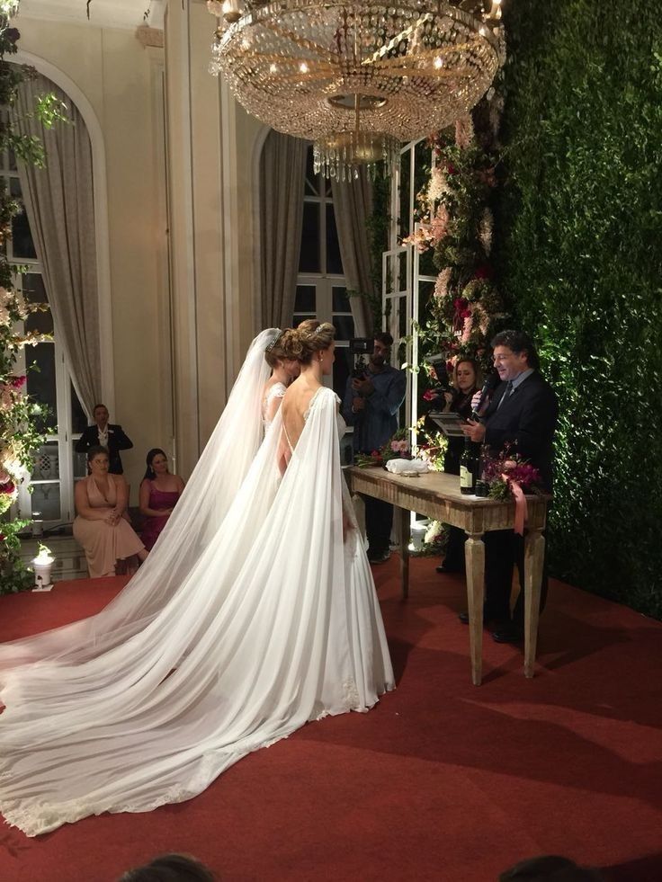 the bride and groom are getting married in front of an audience at their wedding ceremony