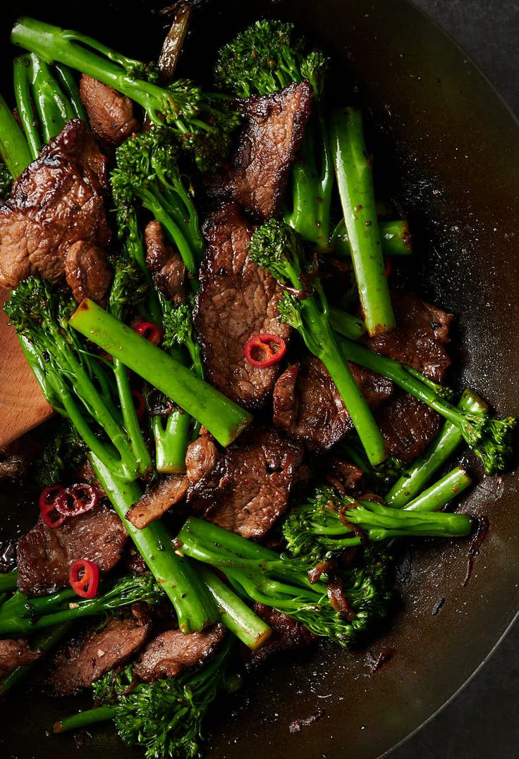 beef and broccoli stir fry in a wok