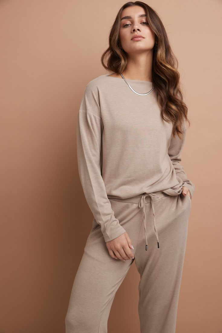 You’re a smart dresser, and you want pieces that serve more than one purpose. This beautiful, minimal top is it. The style perfectly transitions from casual-comfort to workplace-ready, depending on your mood. It’s fashioned with an elegant boat neckline for a modern yet modest sensibility and has a snug fit that flatters while never feeling too tight or uncomfortable. But what you’ll love most of all is its ease-of-wear: style it with a favourite Rekucci jean or pair it with its matching bottom Versatile Crew Neck Top For Loungewear, Chic Long Sleeve Crew Neck Top For Loungewear, Versatile Everyday Knit Top With Relaxed Fit, Chic Soft Knit Tops For Loungewear, Casual Long Sleeve Top For Loungewear, Versatile Relaxed Fit Knit Top For Everyday, Everyday Versatile Relaxed Fit Knit Top, Casual Long Sleeve Solid Color Top For Loungewear, Relaxed Fit Crew Neck Knit Top For Loungewear