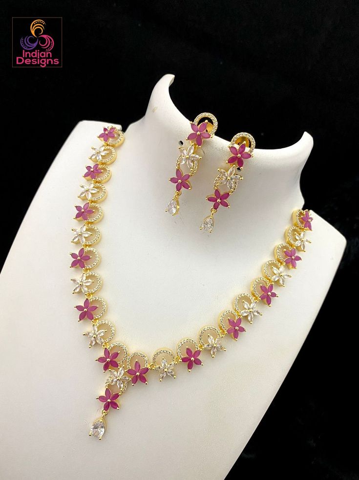 Beautiful star design floral design American Diamond necklace. Available in many colors. Flower Shaped Wedding Costume Jewelry Necklace, Flower Shaped Costume Jewelry Necklace For Wedding, Festive White Cubic Zirconia Necklaces, Pink Cubic Zirconia Flower Pendant Necklace, Dazzling Necklace With Matching Earrings For Gifts, Dazzling Necklaces With Matching Earrings For Gifts, White Cubic Zirconia Necklace With Matching Earrings, Dazzling White Necklace For Festive Occasions, White Dazzling Festive Necklaces