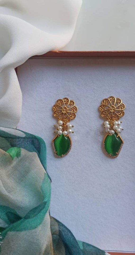 Baroque earrings made of: - Baroque pearls (6 mm), white color; - Geometric Chrysoberyl stones (20 mm x 15 mm), green color; - Brass filigree earrings, round shape Lenght : 4 cm / 1,57 inches * SHIPPING * Your order will be shipped within 1-3 business days from your purchase. You can choose between 2 shipping methods: STANDARD SHIPPING (without tracking) or REGISTERED MAIL (with tracking). * GIFT PACKAGING * If you want the gift box, you can buy it during your order. We will package your jewel i Green Drop Earrings For Celebration, Elegant Green Pearl Earrings For Festive Occasions, Festive Green Earrings With Elegant Design, Green Gemstone Earrings For Party, Green Gemstone Earrings For Celebration, Elegant Green Danglers As Gift, Elegant Green Danglers For Gift, Elegant Green Danglers As A Gift, Elegant Green Danglers For Celebration