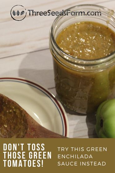 there is a jar of green tomato sauce next to an apple