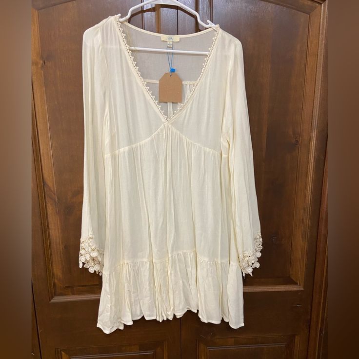 White Long Sleeve Dress Elegant Long Sleeve Boho Dress For Fall, Beige Long Sleeve Boho Dress For Spring, Casual Beige Long Sleeve Boho Dress, Casual Boho V-neck Dress With Lace Trim, Casual Boho Dress With Lace Trim V-neck, Cream Long Sleeve Mini Dress For Spring, Casual Long Sleeve Dress With Lace Trim, Fitted Long Sleeve Boho Dress For Spring, Elegant Spring Tunic Mini Dress