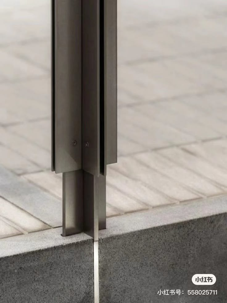 an open door on the side of a building next to a brick floor and sidewalk