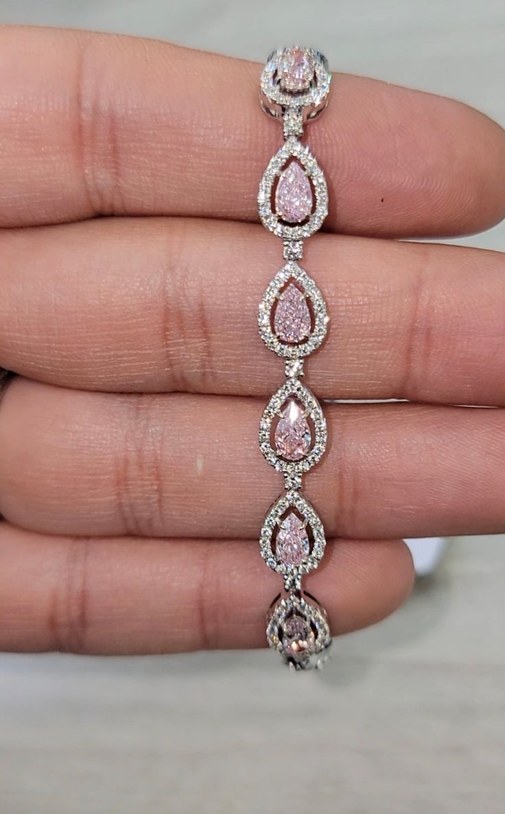 Gorgeous bracelet with 4.59cts of Pink Diamond Pear shapes with sweet color, full of life and no bow ties 2.22ct of white rounds 18kt Gold Pink Diamond Bracelet, Jewel Bracelet, Expensive Purses, Pear Shapes, Pink Diamond Jewelry, Color Full, Gorgeous Bracelet, Pink Diamond, Conflict Free Diamonds