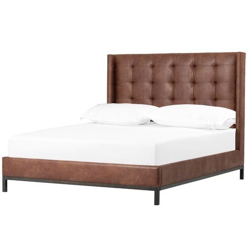 a bed with a brown headboard and white sheets on it's side, against a white background