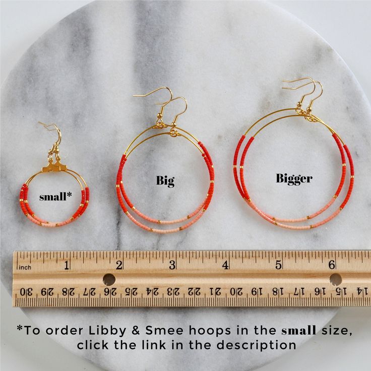 You asked for bigger beaded hoops and Libby & Smee answered! These dangly hoop earrings are the pieces you'll grab every day when you want a little something fun without a lot of fuss. Bonus: They look great dressed up or super casual. beaded hoops with tiny glass seed beads style: OMBRE — red, orange, peach and pale blush with gold available in two large sizes: BIG, a teardrop shape approximately 1.75 inches wide and 2.75 inches long, or BIGGER, a circle shape 2.25 inches wide and 3 inches long Adjustable Hoop Jewelry With Dangling Beads, Adjustable Small Hoop Jewelry With Dangling Beads, Nickel-free Adjustable Hoop Beaded Earrings, Adjustable Hoop Earrings With Dangling Beads, Adjustable Hypoallergenic Hoop Beaded Earrings, Nickel Free Hoop Beaded Earrings For Everyday, Adjustable Small Hoop Earrings With Dangling Beads, Adjustable Hoop Beaded Earrings With Dangling Beads, Adjustable Hypoallergenic Beaded Hoop Earrings