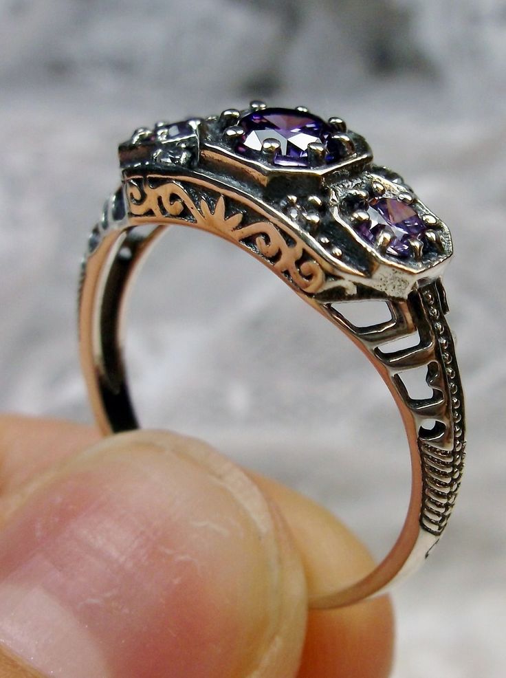 Art deco style ring with three Purple amethyst CZs set in sterling silver filigree Sterling Silver Amethyst Wedding Ring, Wedding Sterling Silver Amethyst Ring, Antique Silver Three Stone Jewelry, Elegant Silver Birthstone Ring With Stone Setting, Purple Three Stone Wedding Jewelry, Victorian Filigree Ring With Accent Stones In Sterling Silver, Silver Hallmarked Amethyst Ring For Anniversary, Vintage Amethyst Ring With Intricate Design For Anniversary, Ornate Jewelry With Prong Setting For Promise Ring