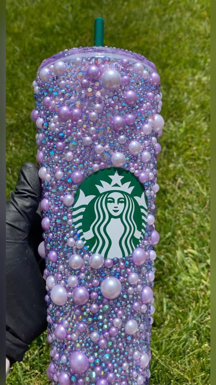 a starbucks cup made out of beads and pearls