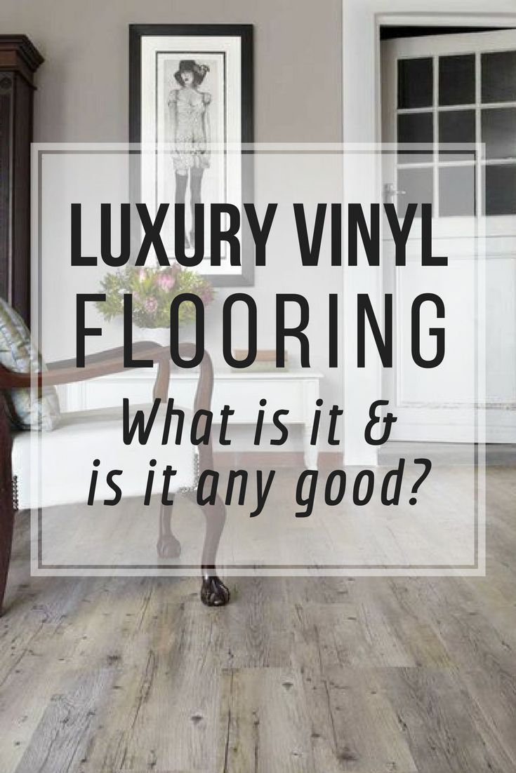 a living room with wood floors and white walls, the words luxury vinyl flooring what is it & is it any good?