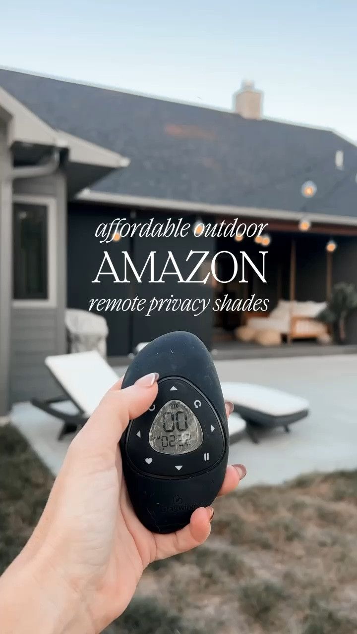 someone holding an alarm clock in front of a house with the words, appropriate outdoor amazon remote privacy shades