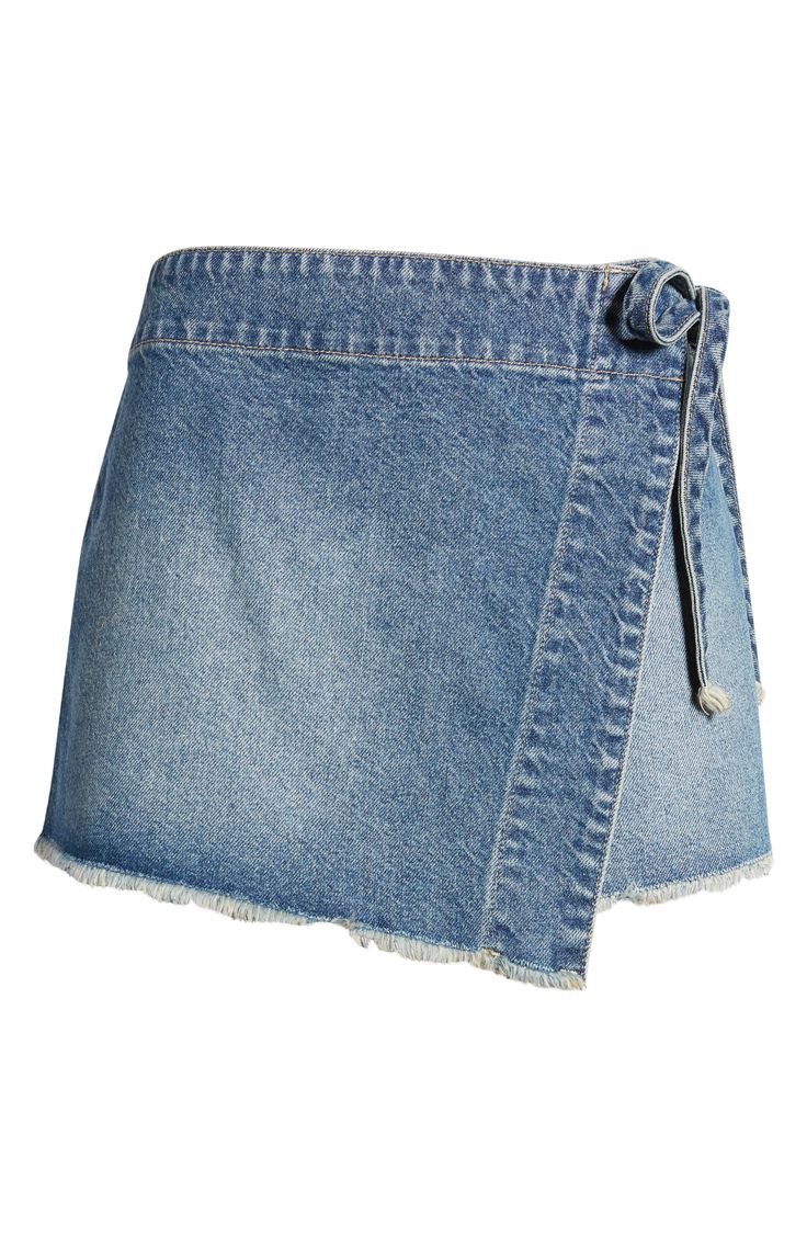 This supercute light-wash skort with raw hems closes with a little tie at the hip. 2 1/2" inseam; 28" leg opening; 12 1/2" front rise; 15 1/2" back rise (size 8) 100% cotton Machine wash, tumble dry Imported Jean Skort, Denim Skort, Free People, Size 10, Nordstrom, Photography, Blue, Clothes