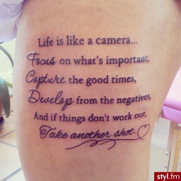 a woman with a tattoo on her thigh that says, life is like a camera focus on what's important capture the good times