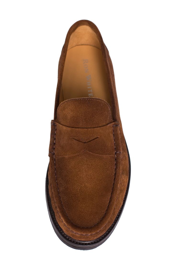 A classic penny keeper and supple suede upper lend timeless sophistication to a luxe loafer grounded by a cushioned footbed and slip-resistant lug sole. Multilayered, PORON®-cushioned footbed Slip-resistant sole Weatherproof Leather upper and lining/rubber sole Made in Italy Masculine Suede Moc Toe Loafers, Classic Moccasins With Suede Lining For Business Casual, Masculine Suede Loafers With Plain Toe, Classic Suede-lined Moccasins For Business Casual, Classic Wingtip Suede Loafers, Classic Suede Wingtip Loafers, Classic Slip-on Oxfords With Suede Lining, Classic Suede Loafers With Rubber Sole, Classic Suede Moc Toe Oxfords