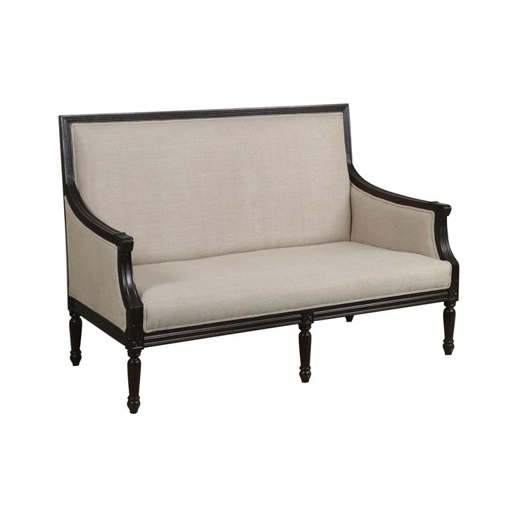 a black and white couch sitting on top of a wooden frame with beige upholstered fabric