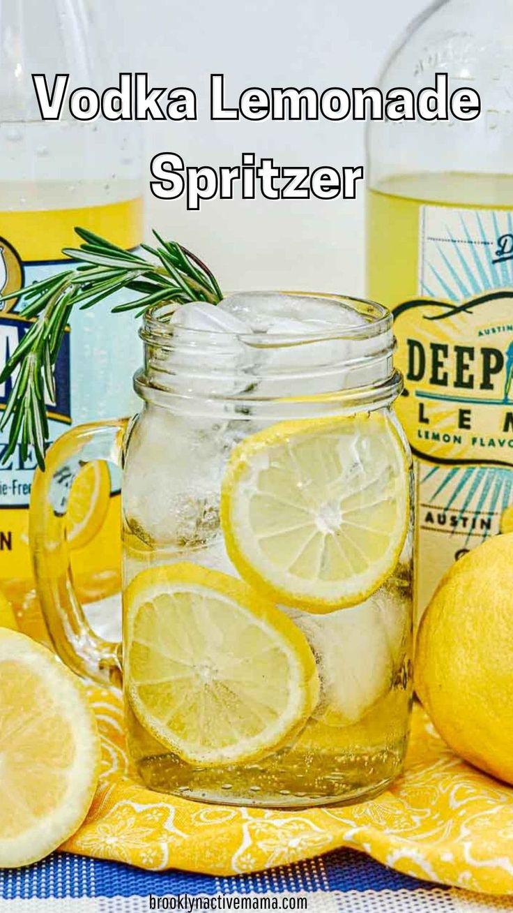 vodka lemonade spritzer in a mason jar surrounded by lemons and rosemary