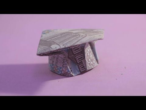 an origami graduation cap made out of money