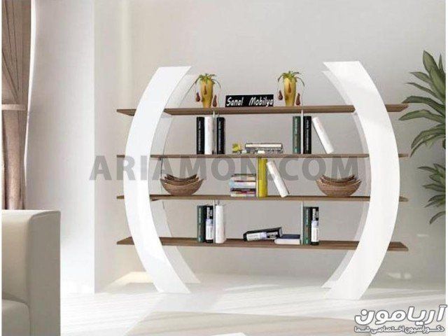 a book shelf with books on it in a living room