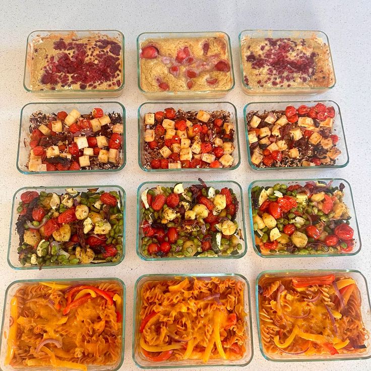 six square glass dishes filled with different types of food and toppings on top of a white table