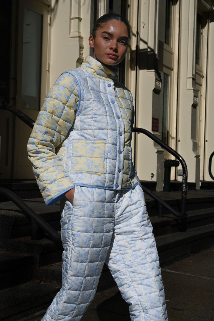 Made for cooler weather and featuring our original Butter Toile print, the Ada Quilted Joggers can be worn alone or with our quilted jackets of the same design. Off-white base with baby blue florals Soft matte quilted fabric Stretchy waistline and cinch at ankle Secure front pockets and front zipper closure Lightweight warmth 29" inseam on size XS Made from recycled poly Your order will ship from our warehouse in Florida, USA! Quilted Joggers Outfit, Blue Quilted Puffer Jacket With Long Sleeves, Casual Blue Quilted Outerwear, Quilted Joggers, Blue Quilted Outdoor Outerwear, Winter Outfits Snow, Toile Print, Blue Toile, Snow Outfit