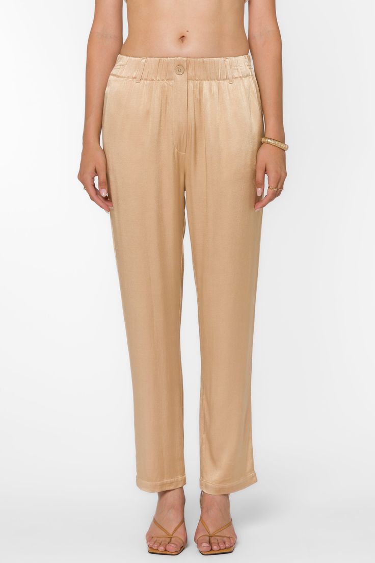 Expertly crafted with pull-on design, Sherona Pants combine luxurious satin material with functional features such as fly front and belt loops. Enjoy ultimate comfort and convenience in these elegant pajama pants. Material: 100% Viscose Color: Sesame Hand wash or dry clean Model is 5'9'' and is wearing a size S Imported Chic Silk Pants For Daywear, Spring Satin Bottoms With Elastic Waistband, Elegant Pull-on Pants For Daywear, Casual High-waisted Satin Pants, Casual Satin Trousers, Elegant Pants With Elastic Waistband For Daywear, Solid Satin Pants With Elastic Waistband, Chic Satin Tapered Leg Pants, Elegant Satin Bottoms For Daywear