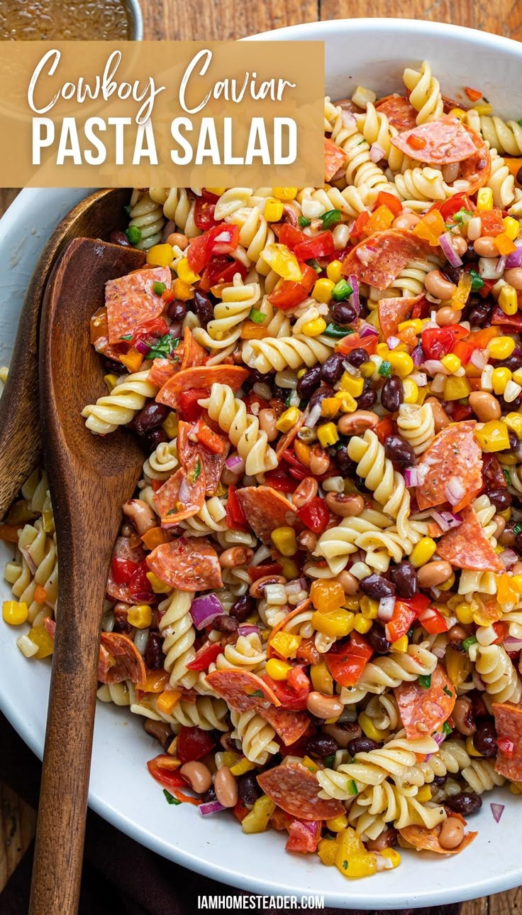 A large bowl of cowboy caviar pasta with a wooden serving spoon in the bowl. Cowboy Caviar Pasta, Caviar Pasta, Italian Vinaigrette, Summer Pasta Salad Recipes, The Perfect Salad, Cold Pasta Salad Recipes, Perfect Salad, Cowboy Caviar, Cold Pasta Salad