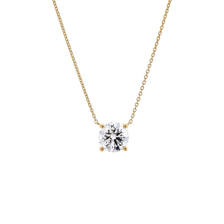 Introducing the Adina Eden Lab Grown Diamond Round Solitaire Necklace, a timeless and elegant piece crafted from a blend of 14K gold and 14K white gold. This necklace features a single solitaire brilliant-cut lab-grown diamond, showcasing exceptional brilliance with a color grade of G and clarity of VS1. Available in five carat sizes—0.25 CT, 0.5 CT, 1 CT, 1.5 CT, and 2 CT—this necklace allows you to choose the perfect size to suit your style. The necklace measures 16 inches in length and includ Classic 14k Yellow Gold Solitaire Necklace, Timeless Solitaire Necklace For Formal Occasions, Timeless 14k Gold Solitaire Diamond Necklace, Refined Solitaire Cubic Zirconia Jewelry, Solitaire Diamond Jewelry For Everyday Luxury, Everyday Luxury Yellow Gold Necklace With Single Diamond, Formal White Gold Necklace With Brilliant Cut, Classic 14k Gold Oval Solitaire Necklace, Luxury Yellow Gold Solitaire Necklace With Round Cut