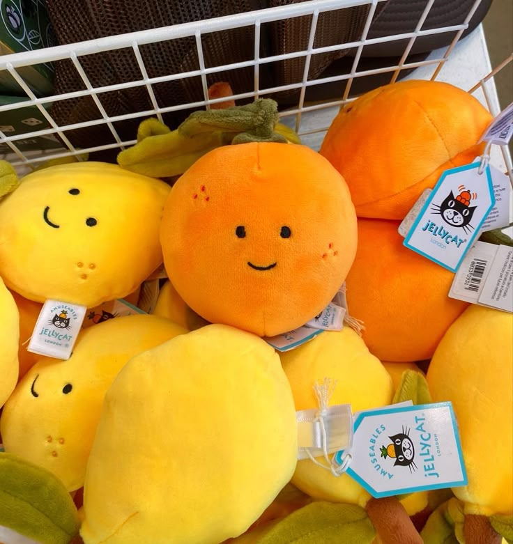 a basket filled with stuffed oranges and bananas