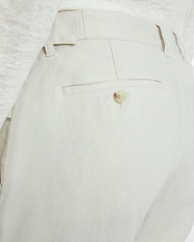 Cut with a tapered leg that falls to a 31" inseam, our Linen Trouser is a classically tailored pant featuring front and back pockets, a zip fly with a button-front closure, and belt loops as well as adjustable buckled tabs at either side of the waist. Casual Bottoms With Welt Pockets For Tailoring, Tapered Leg Bottoms With Hidden Button Closure For Work, Tapered Leg Pants With Hidden Button Closure For Work, Spring High-waisted Pants With Concealed Placket, Tailored Casual Bottoms With Concealed Placket, Formal Spring Bottoms With Patch Pockets, Business Casual Straight Leg Bottoms With Hidden Button, Straight Leg Bottoms With Hidden Button Closure For Workwear, Straight Chinos With Button Closure For Work