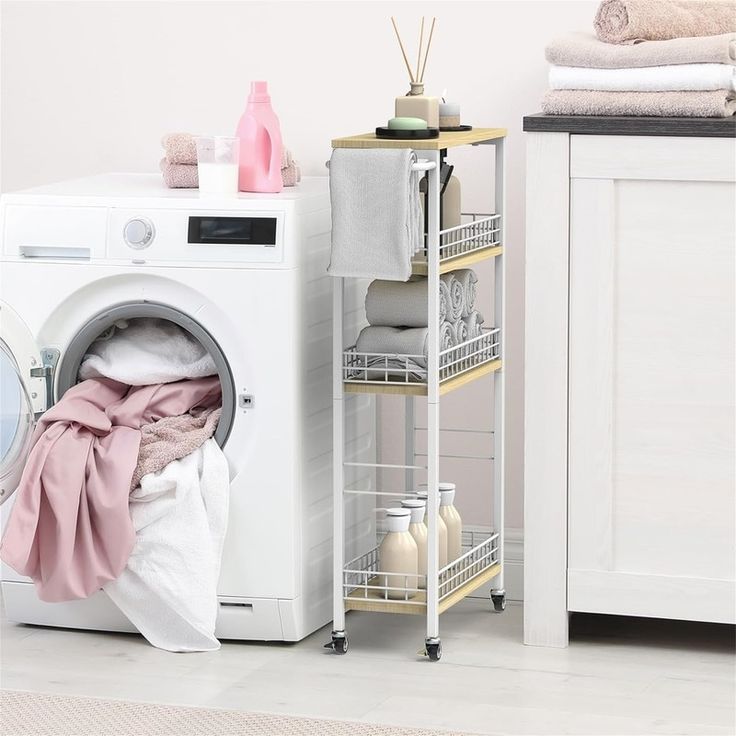 a white washer sitting next to a dryer in a room