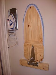 a surfboard mounted to the side of a wall next to a phone charger