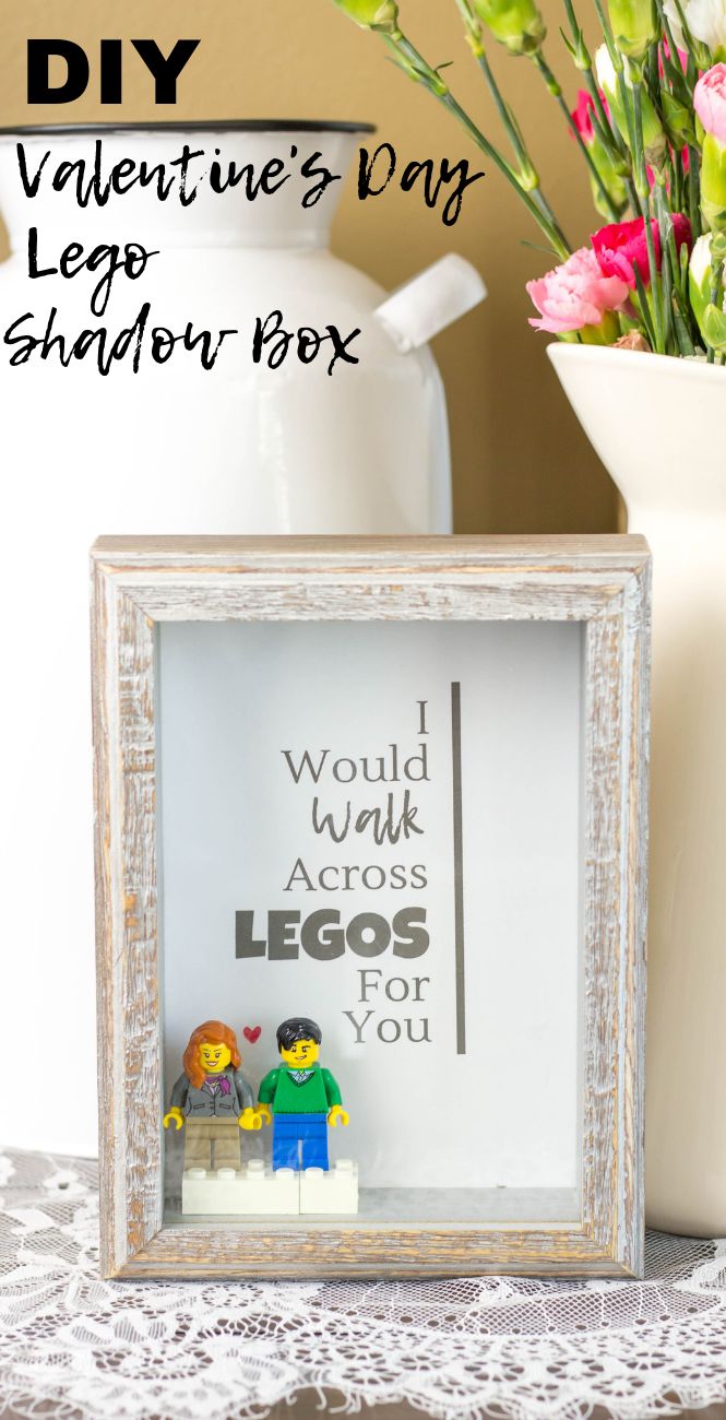 an old frame is used as a shadow box for legos and vases with flowers in the background