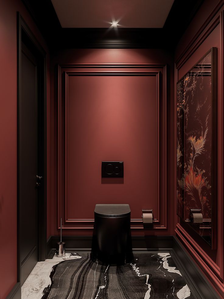 a bathroom with red walls and black flooring