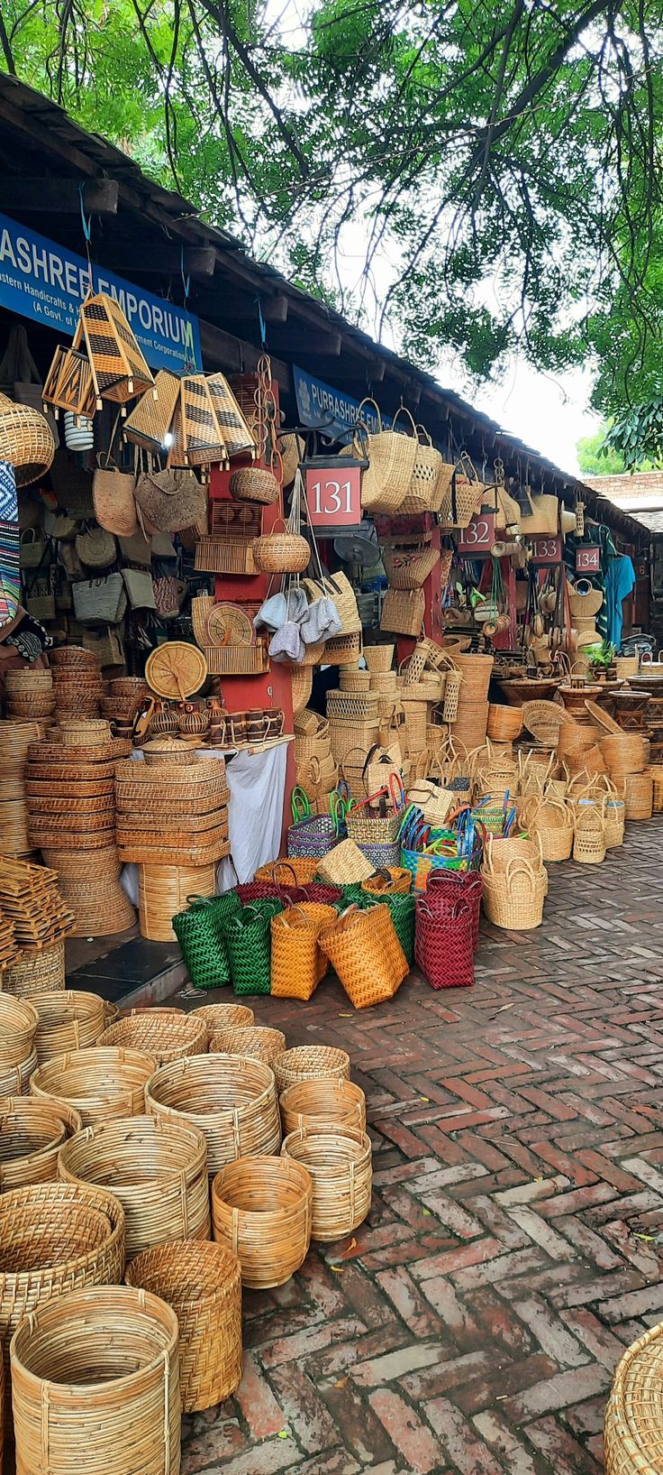 baskets and other items for sale at an outdoor market