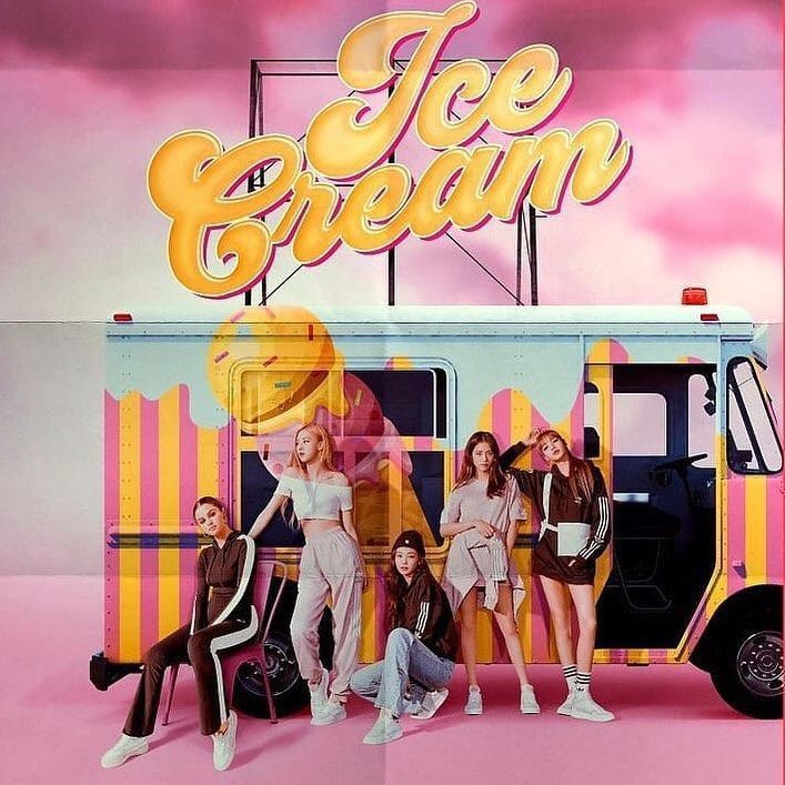 the girls are posing in front of an ice cream truck