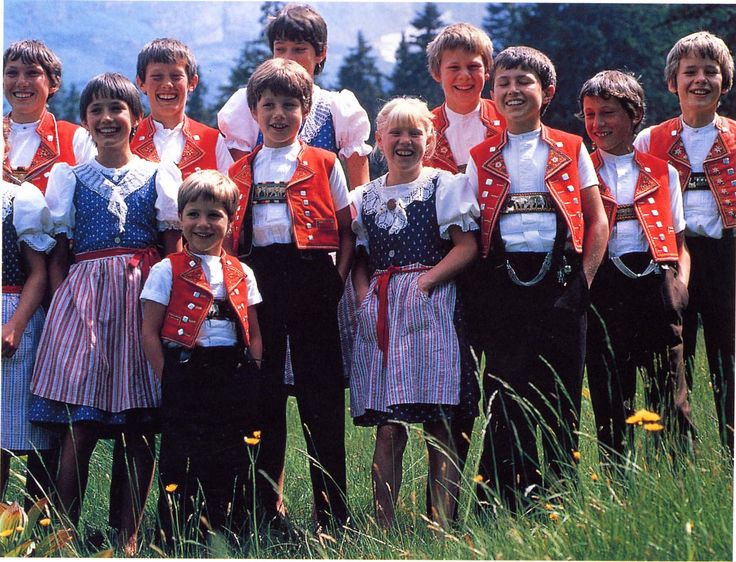 a group of young children standing next to each other