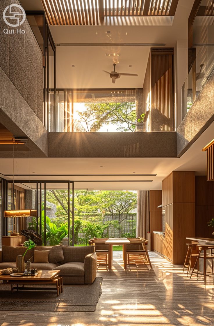 a living room filled with furniture and lots of windows