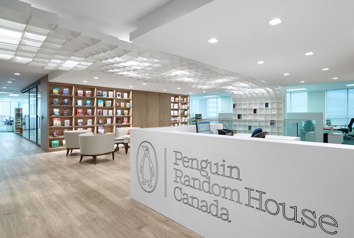 the penguin random house in canada is full of bookshelves and desks with chairs